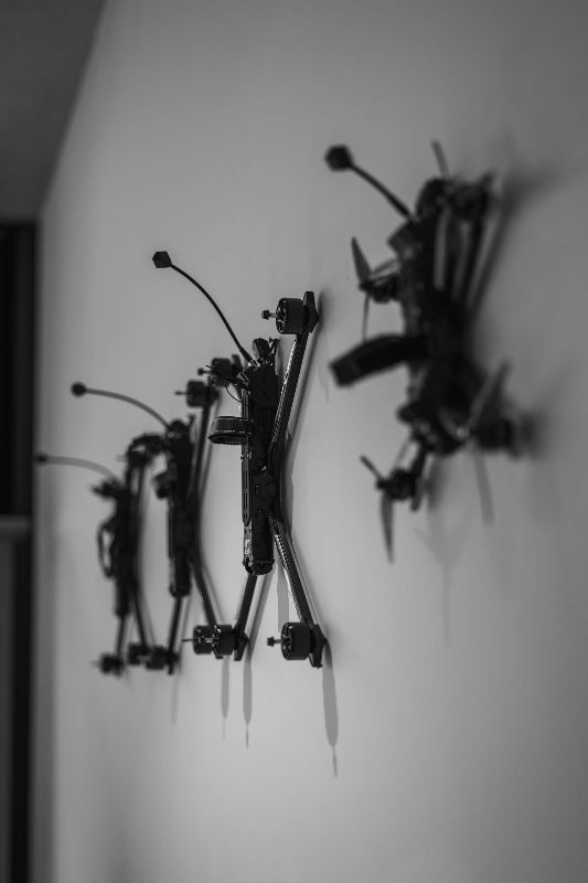 FPV airframes mounted on a wall